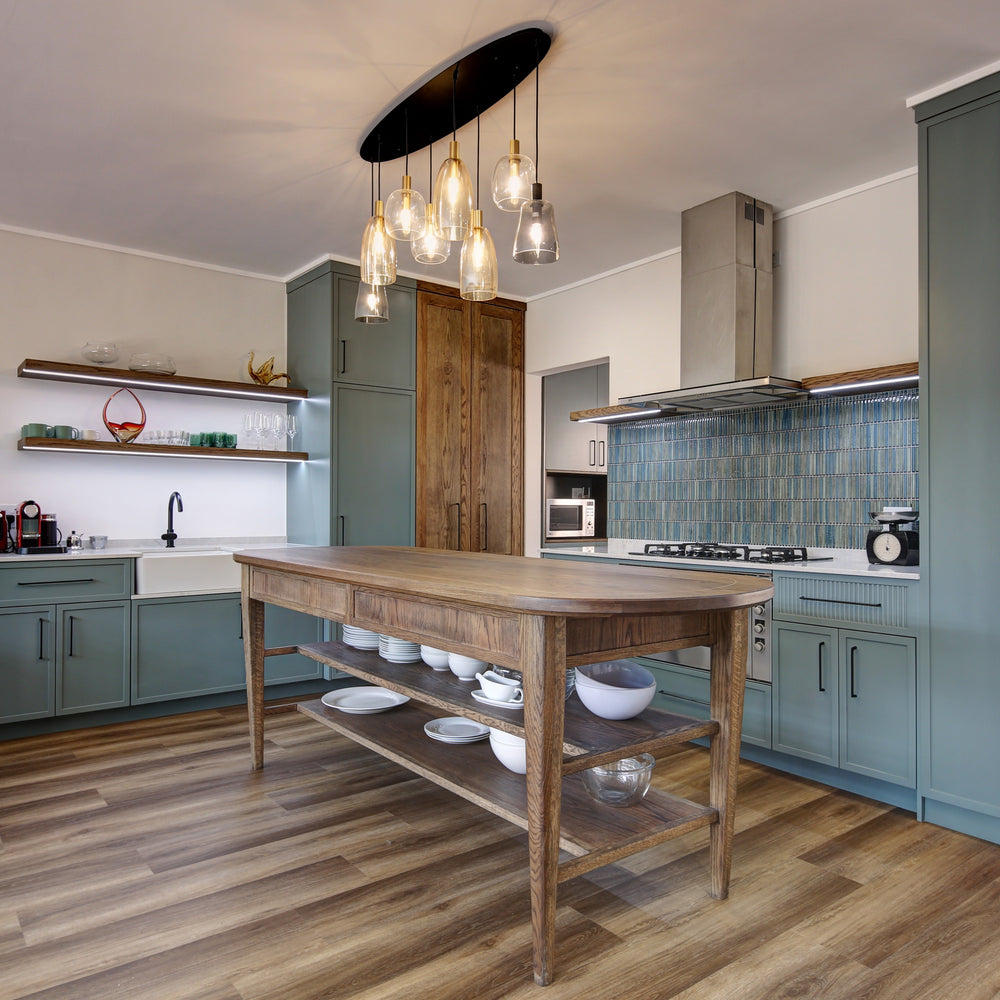 Modern kitchen with wooden island and pendant lights