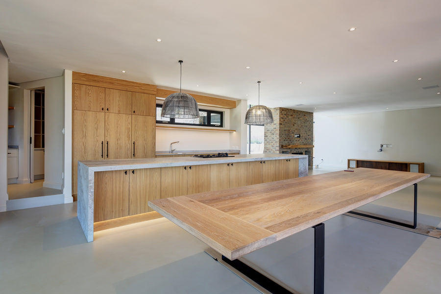 Modern kitchen with wooden island and concrete floor