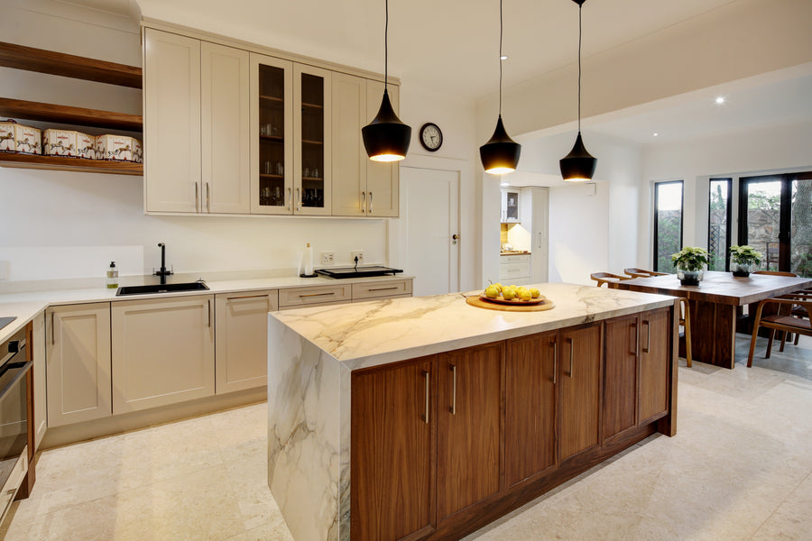 Modern kitchen with marble island and wooden cabinets